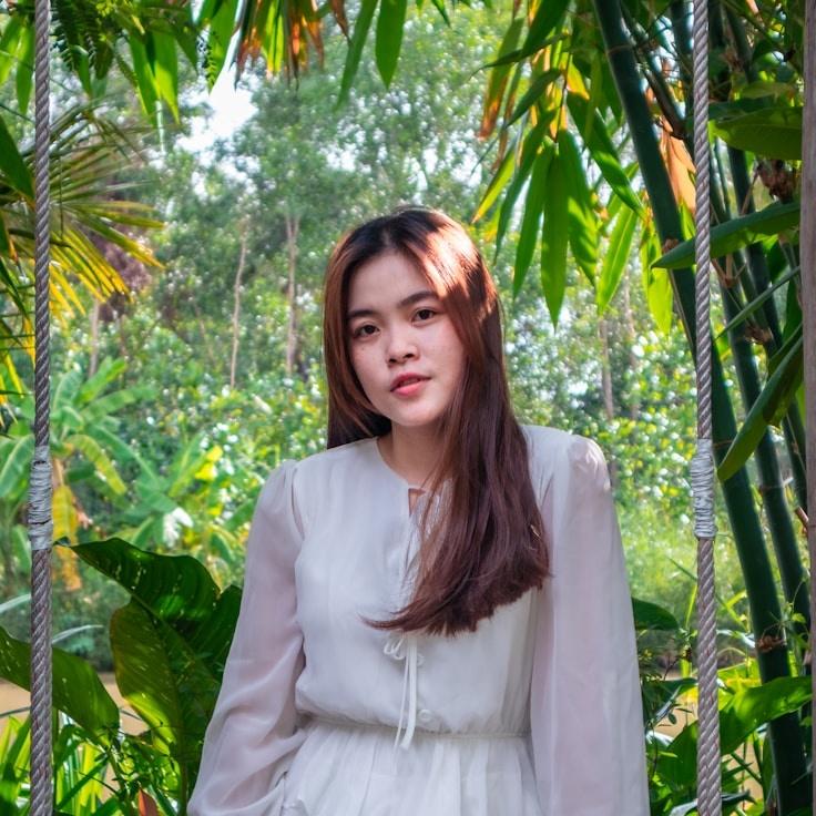 Kaveri Mehta, Lead Design Curator at Luminex Vector Flow, reviewing corporate floral arrangements